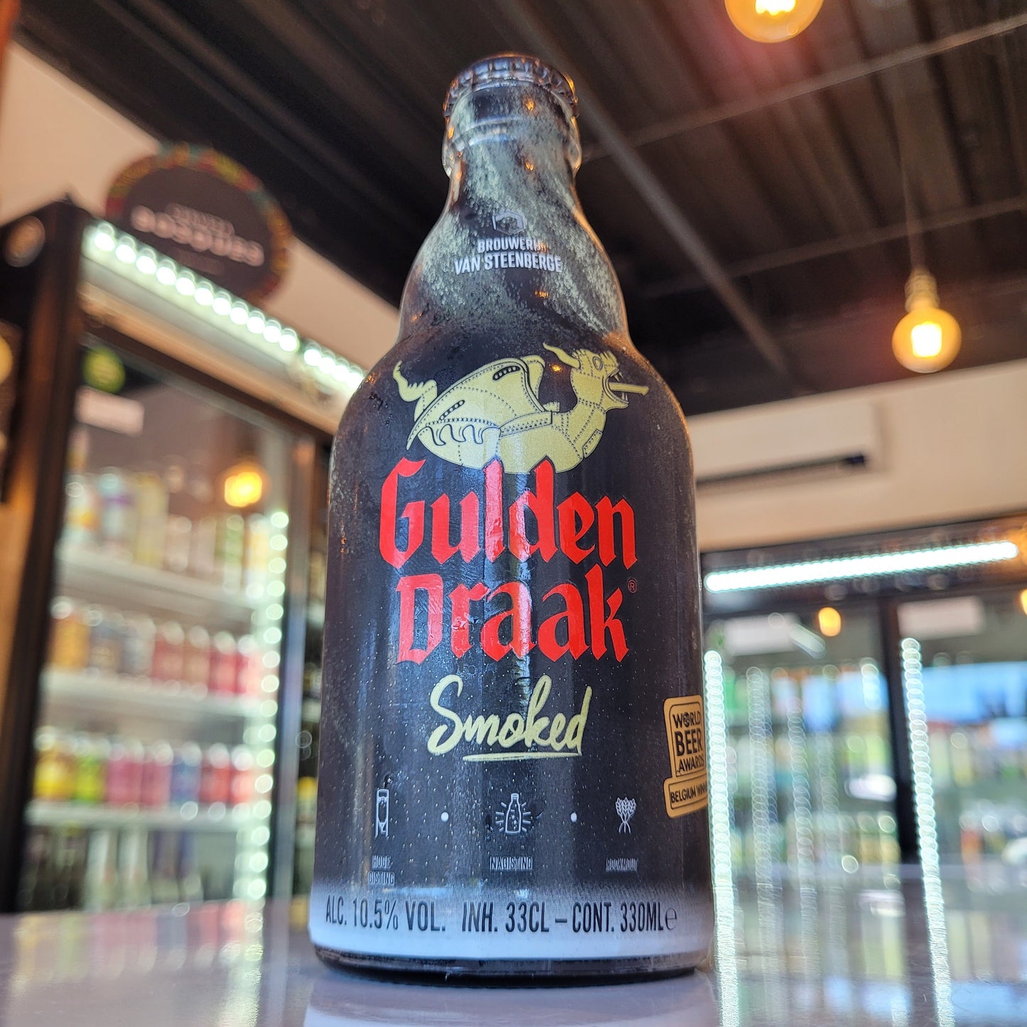 Foto de Gulden Draak Smoked Strong Ale 330ml - Cerveza Artesanal en Puerto Cervecero, Puerto Varas