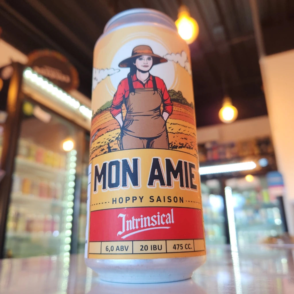 Lata de cerveza artesanal Intrinsical Mon Amie Hoppy Saison 475cc con 6.0% ABV y 20 IBU en Puerto Cervecero, Puerto Varas