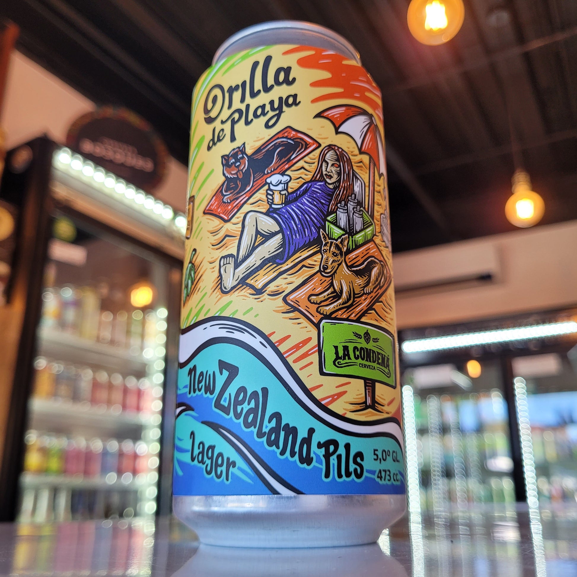 Foto de La Condená Orilla de Playa NZ Pilsner 473ml - Cerveza Artesanal en Puerto Cervecero, Puerto Varas