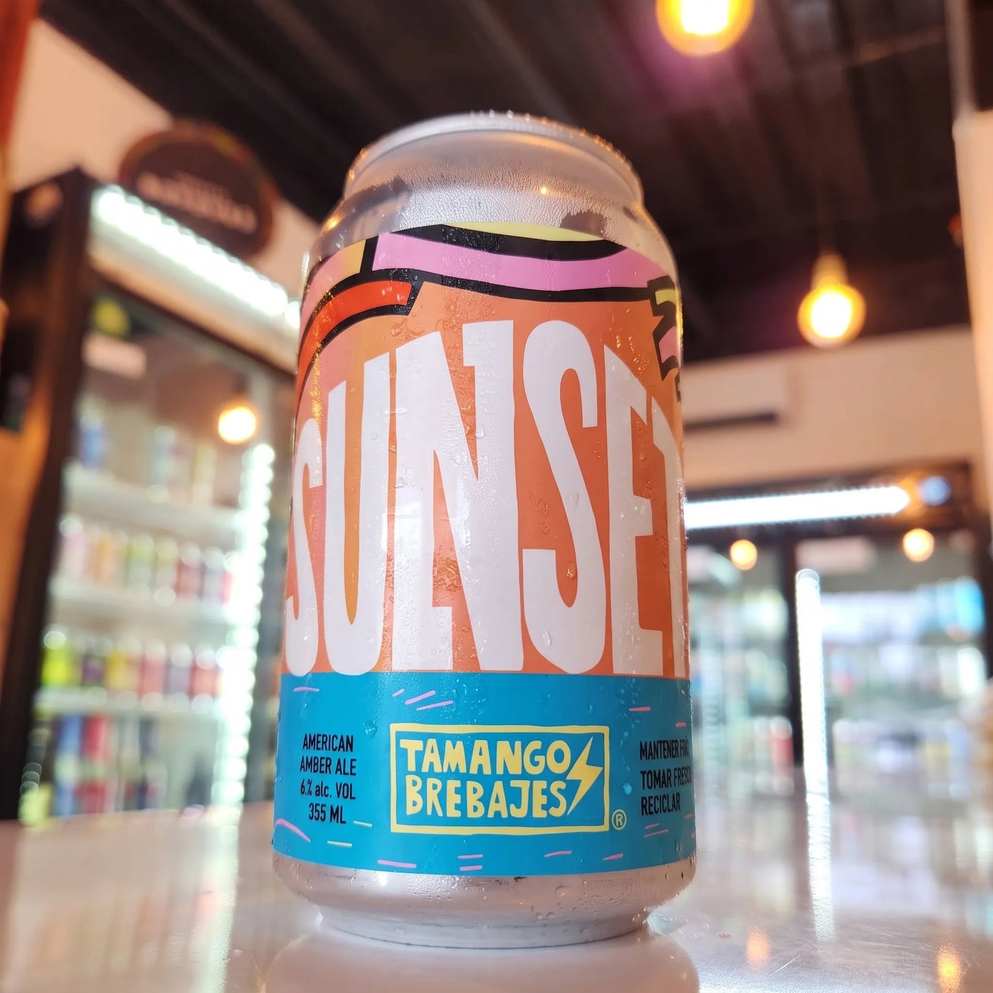 Cerveza artesanal chilena Tamango Sunset American Amber Ale 355cc. Disponible en Puerto Cervecero, Puerto Varas Chile.