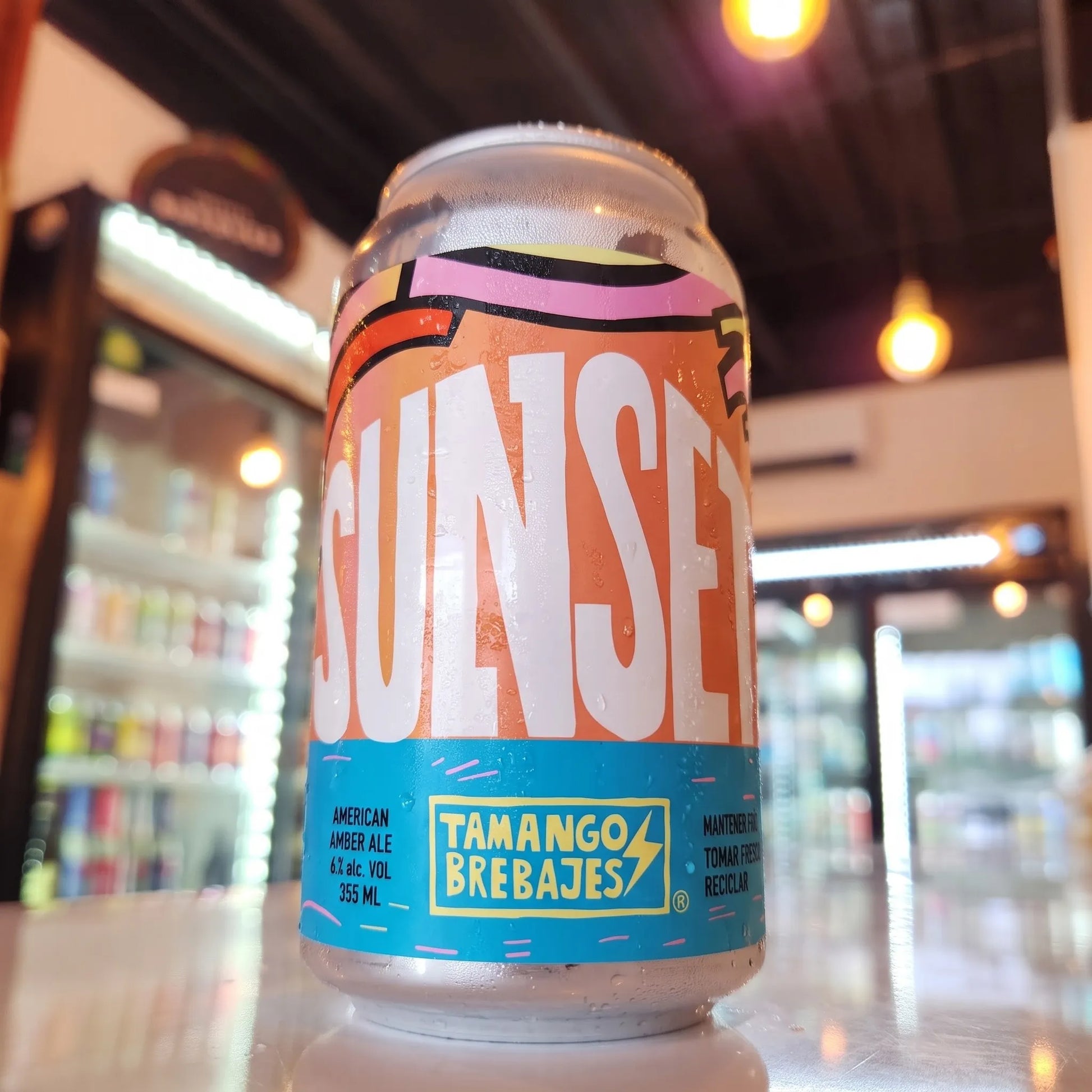 Cerveza artesanal chilena Tamango Sunset American Amber Ale 355cc. Disponible en Puerto Cervecero, Puerto Varas Chile.